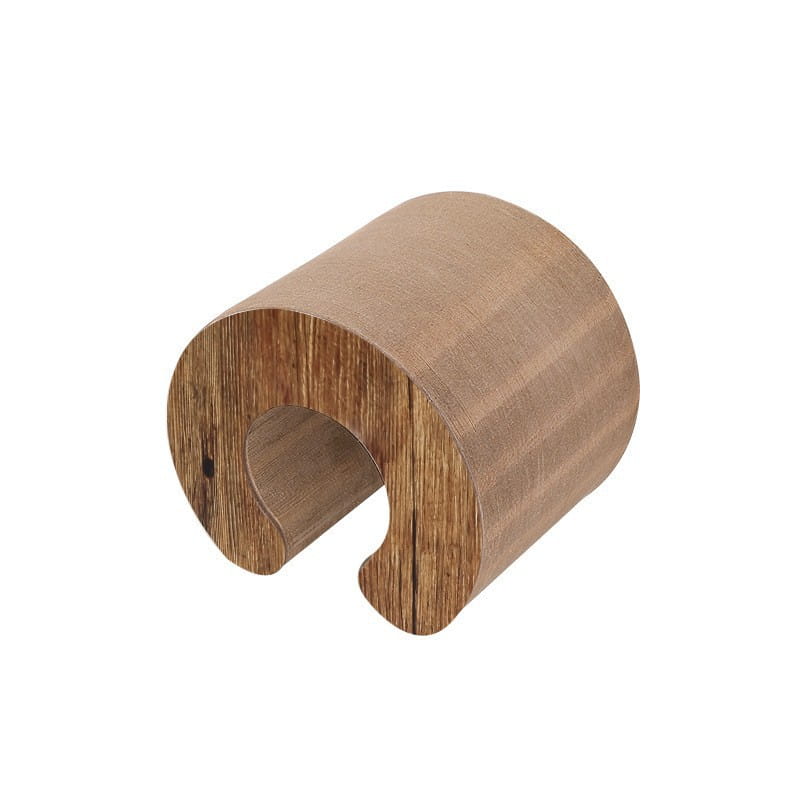 Wooden cylindrical napkin ring on Magic Organ Cat Scratch Board Toy for playful cats